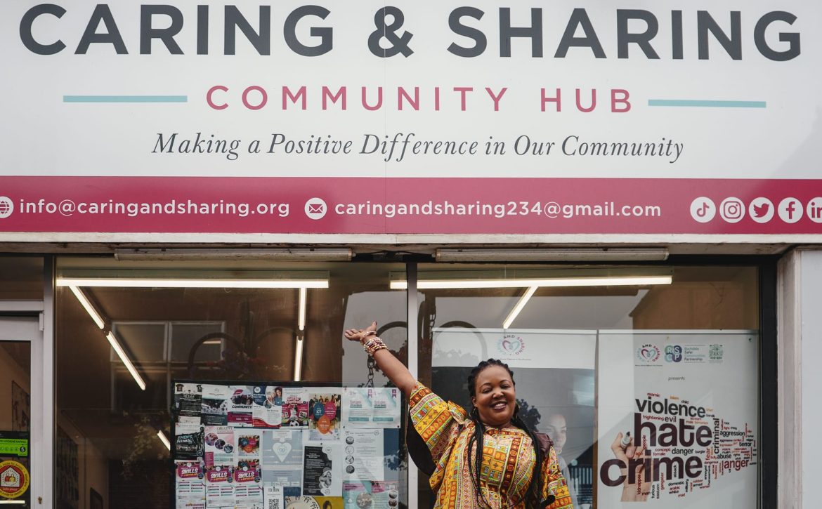 CAS CEO standing in front of the CAS Hub in Rochdale, representing community support and wellbeing initiatives.