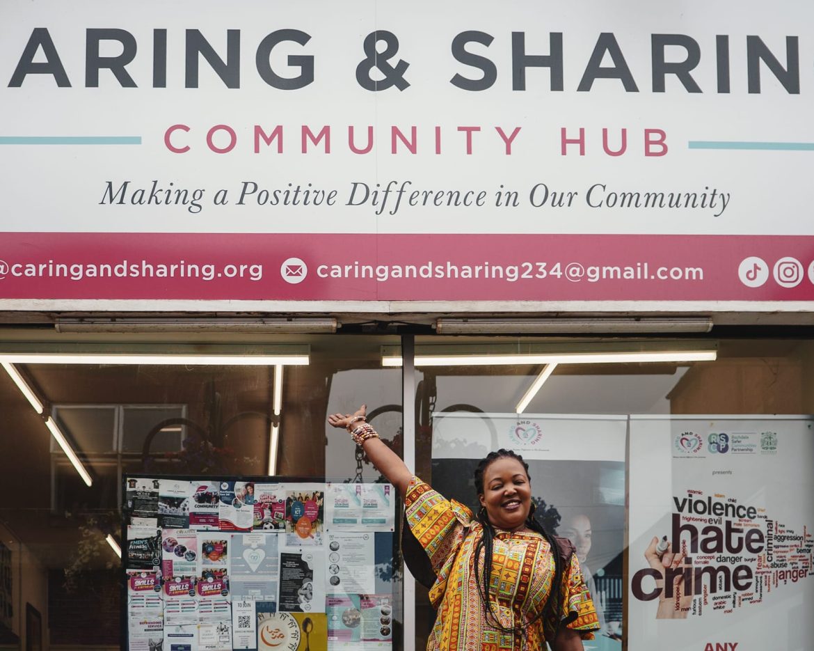 CAS CEO standing in front of the CAS Hub in Rochdale, representing community support and wellbeing initiatives.