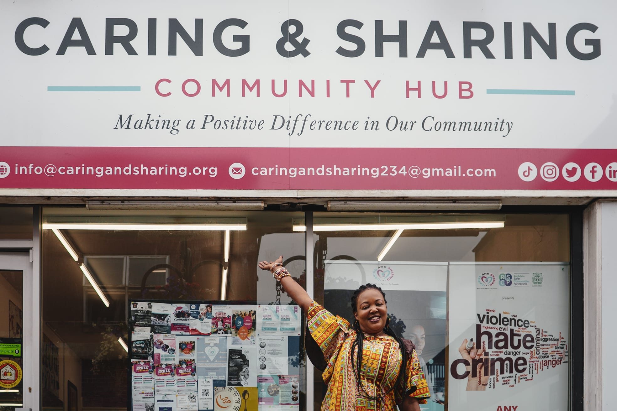 CAS CEO standing in front of the CAS Hub in Rochdale, representing community support and wellbeing initiatives.