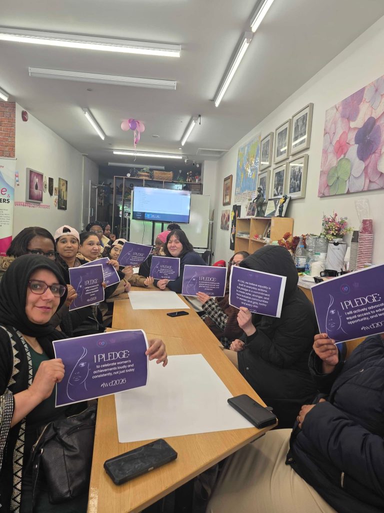 A collective commitment: Members of the Rochdale community gather to share their pledges for an equitable future, embodying the #GiveToGain spirit of International Women’s Day 2026.