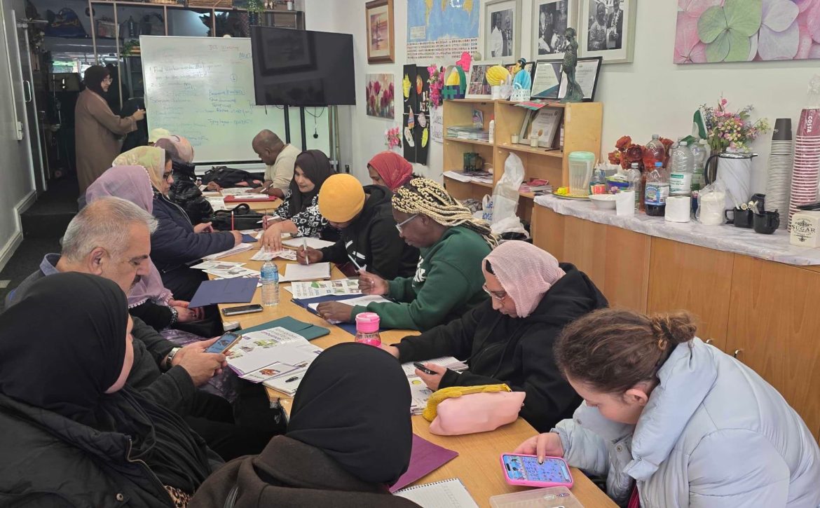 Community support session taking place at the CAS hub with participants engaging in activities