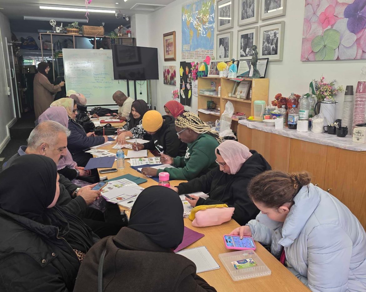 Community support session taking place at the CAS hub with participants engaging in activities