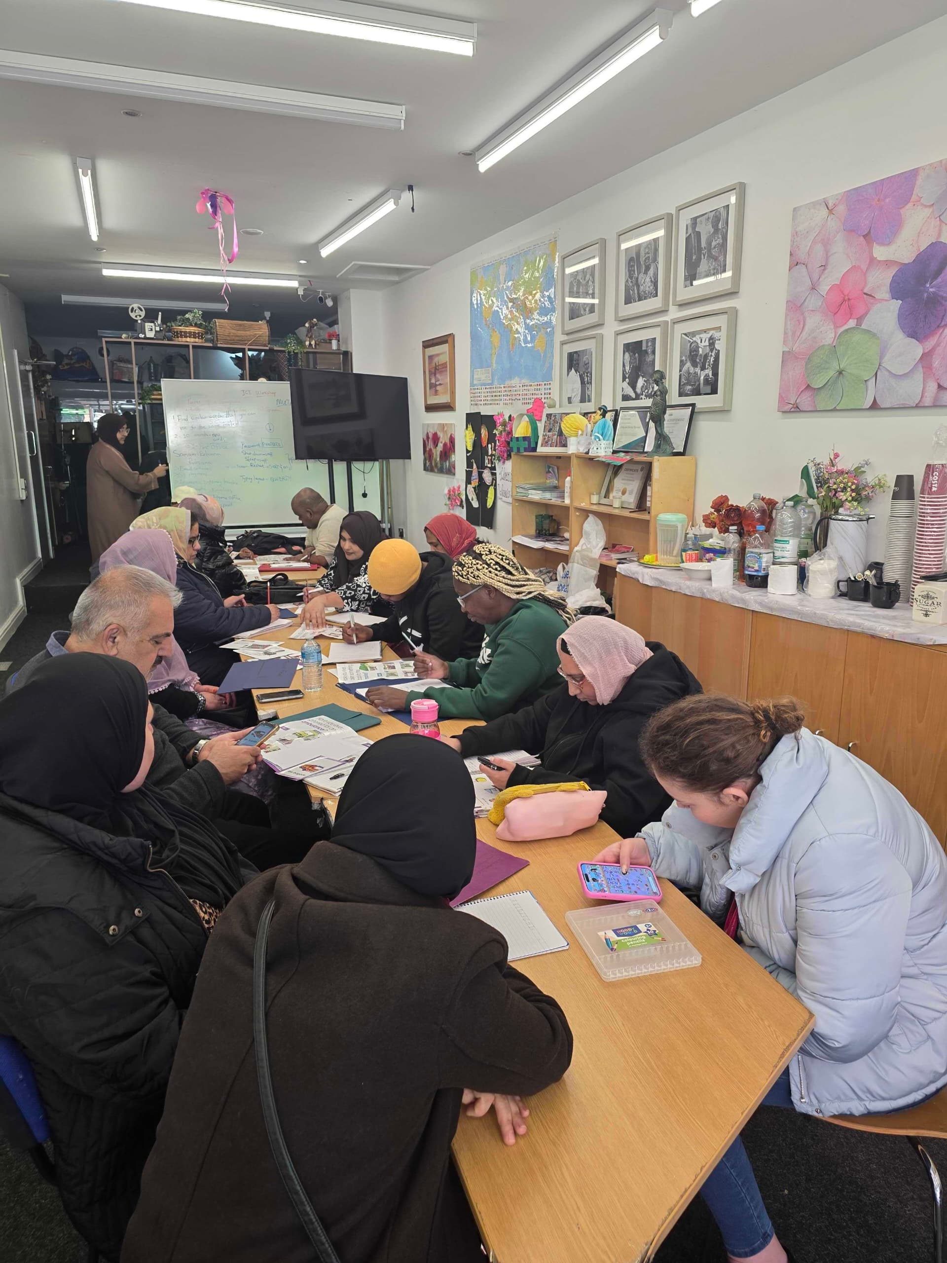 Community support session taking place at the CAS hub with participants engaging in activities
