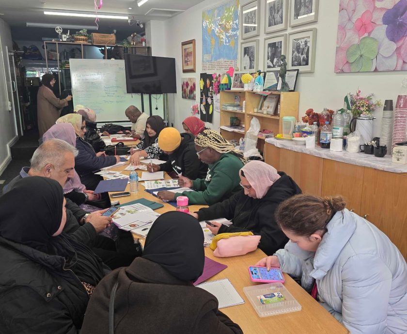 Community support session taking place at the CAS hub with participants engaging in activities