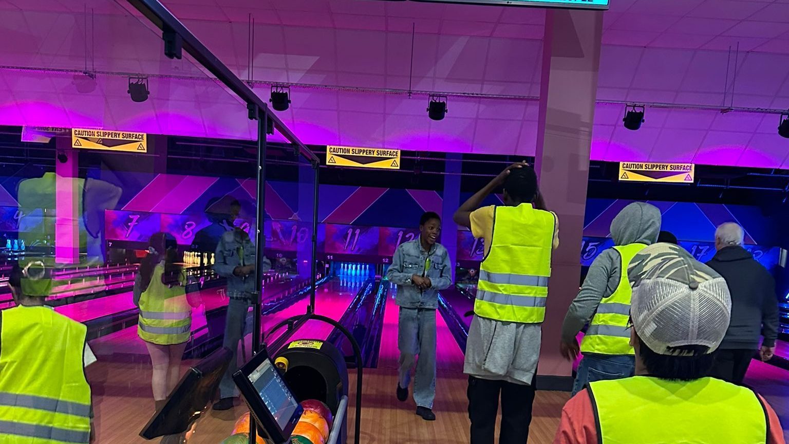 Children enjoying bowling activities at Tenpin during CAS Easter Holiday Activities Programme
