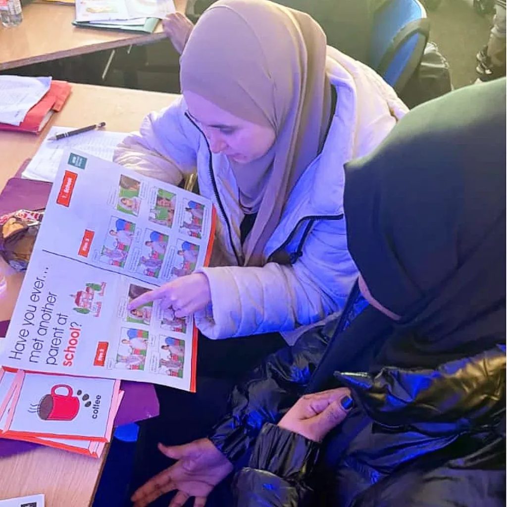 Women engaging in community support activities at the CAS hub