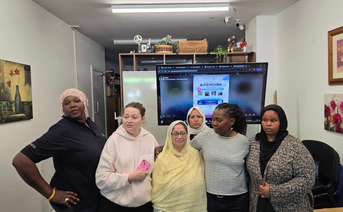 Group of participants gathered together for a community exercise session group photo celebrating wellbeing, inclusion, and active living