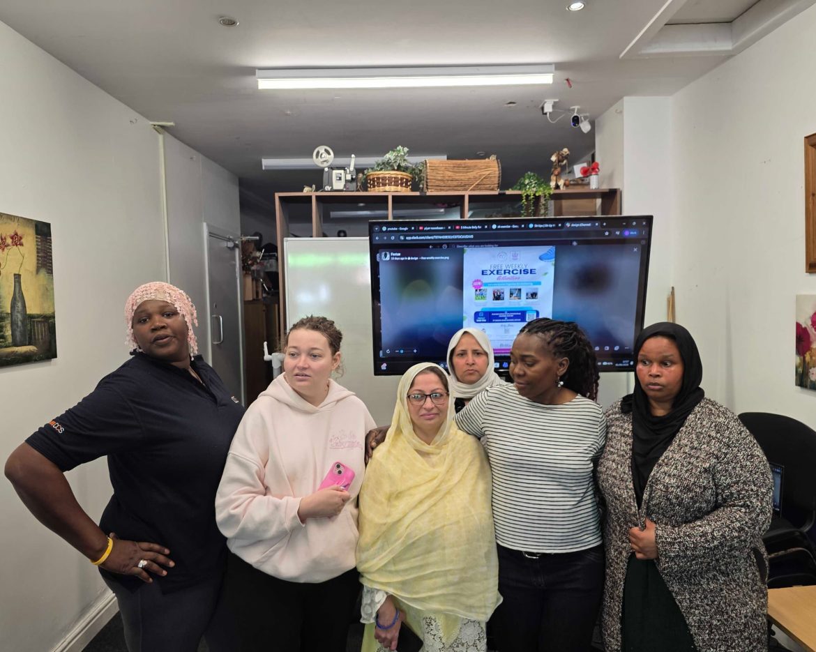 Group of participants gathered together for a community exercise session group photo celebrating wellbeing, inclusion, and active living