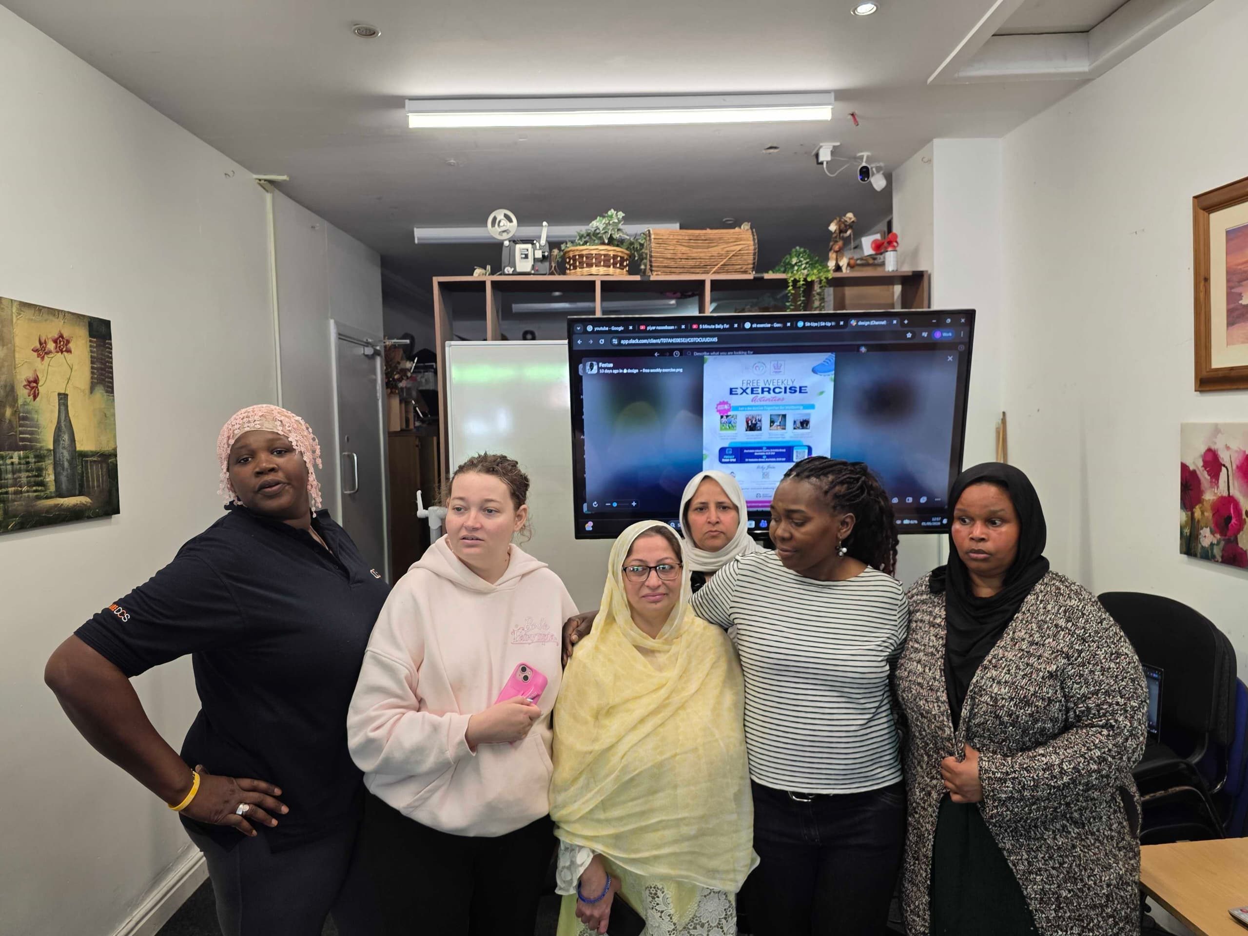 Group of participants gathered together for a community exercise session group photo celebrating wellbeing, inclusion, and active living