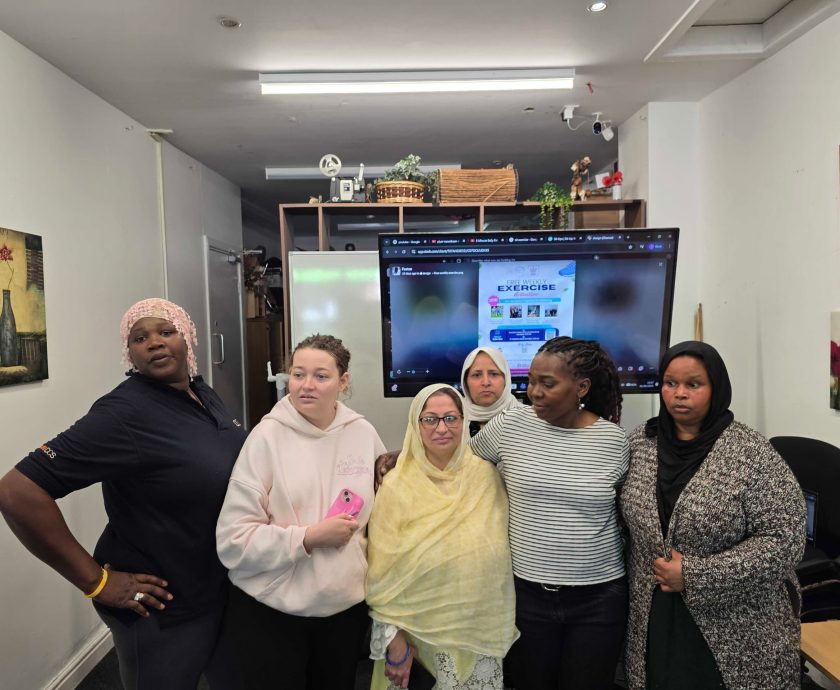 Group of participants gathered together for a community exercise session group photo celebrating wellbeing, inclusion, and active living