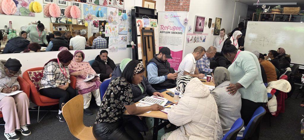 People working together during a CAS community session focused on refugees and asylum seekers