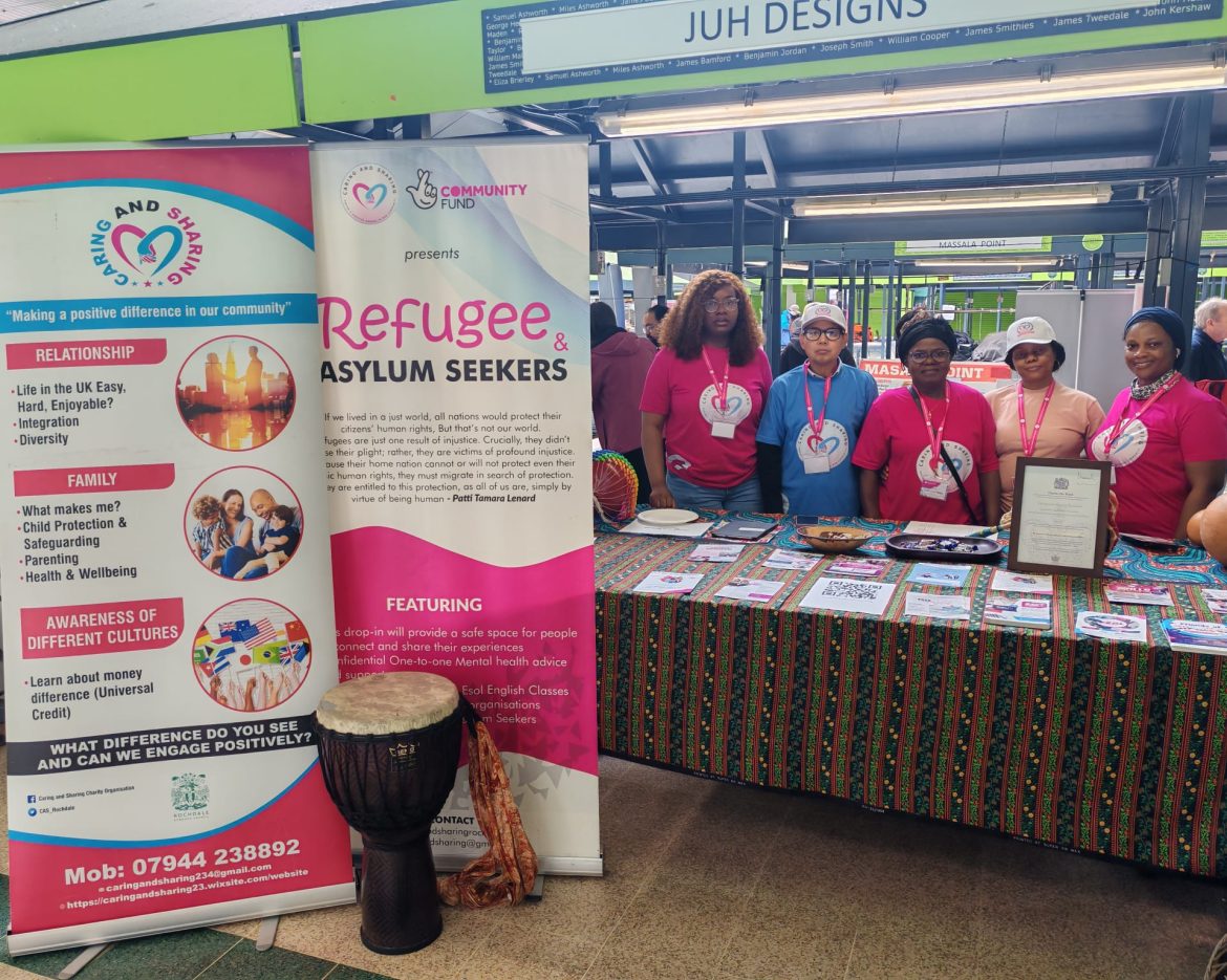 Caring and Sharing Rochdale team at Rochdale Volunteer Fair 2026 engaging with community members at event stand