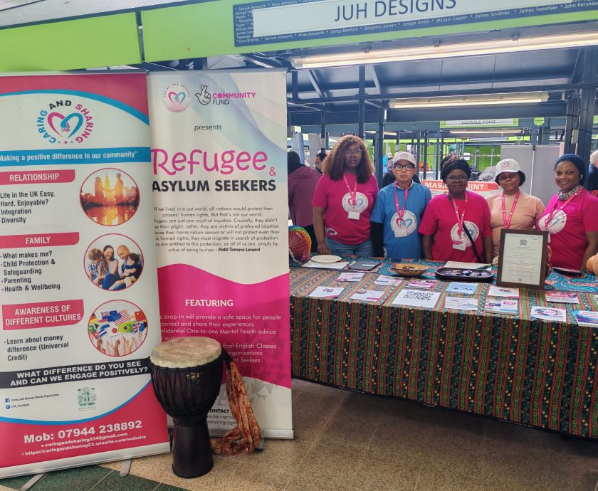 Caring and Sharing Rochdale team at Rochdale Volunteer Fair 2026 engaging with community members at event stand