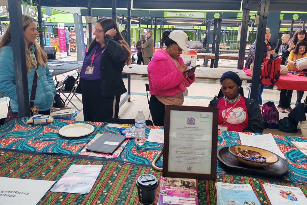 volunteers and residents interacting at fair