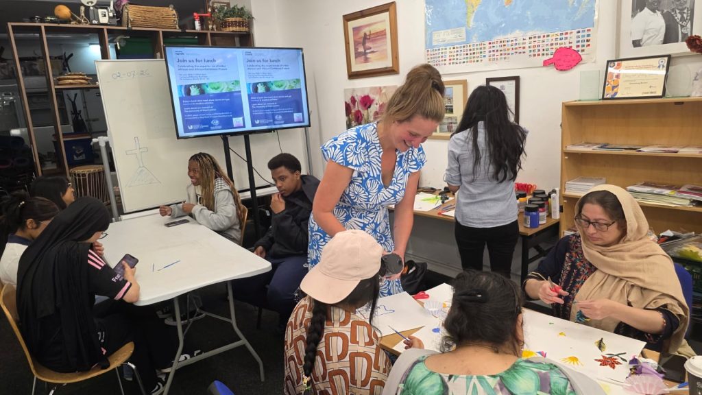 University of West London researcher working with community members.