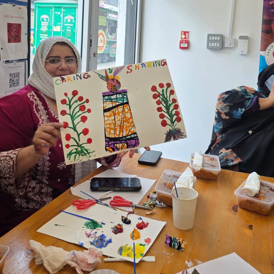 VIP Over 50s Group participant showcasing creative work developed during a community research session with Caring and Sharing Rochdale.