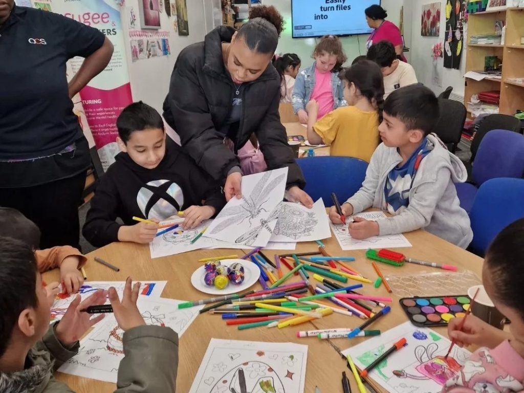 Children taking part in creative arts and crafts during the Holiday Activities and Food Programme in Rochdale.