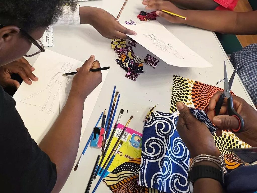 Children creating fabric collages during HAF 2026
