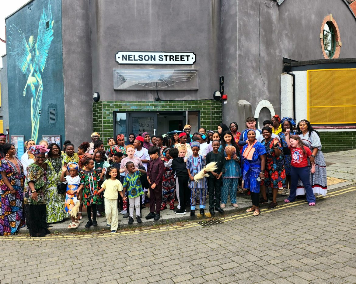 Children and Caring and Sharing Rochdale staff outside Nelson Street Church during the Summer HAF Programme