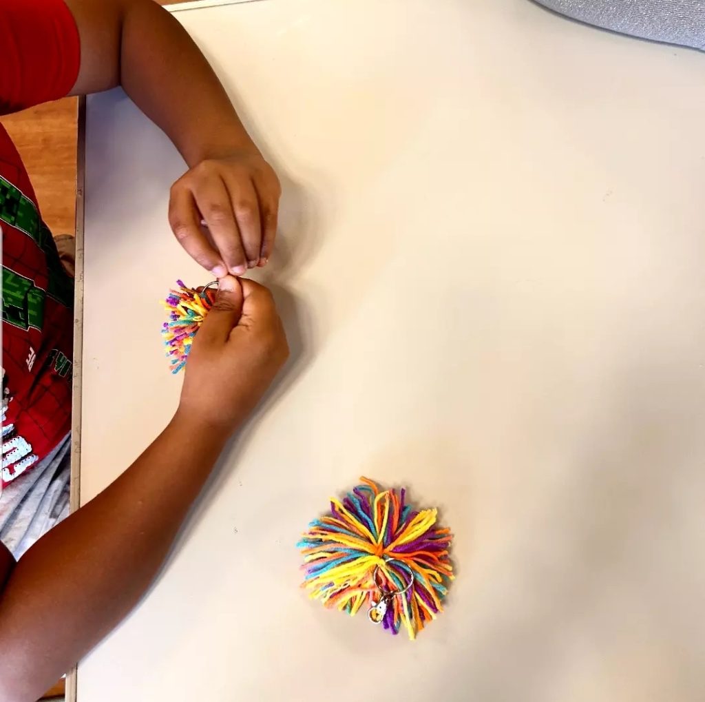 Children creating handmade key holders during a HAF 2026 crafting session